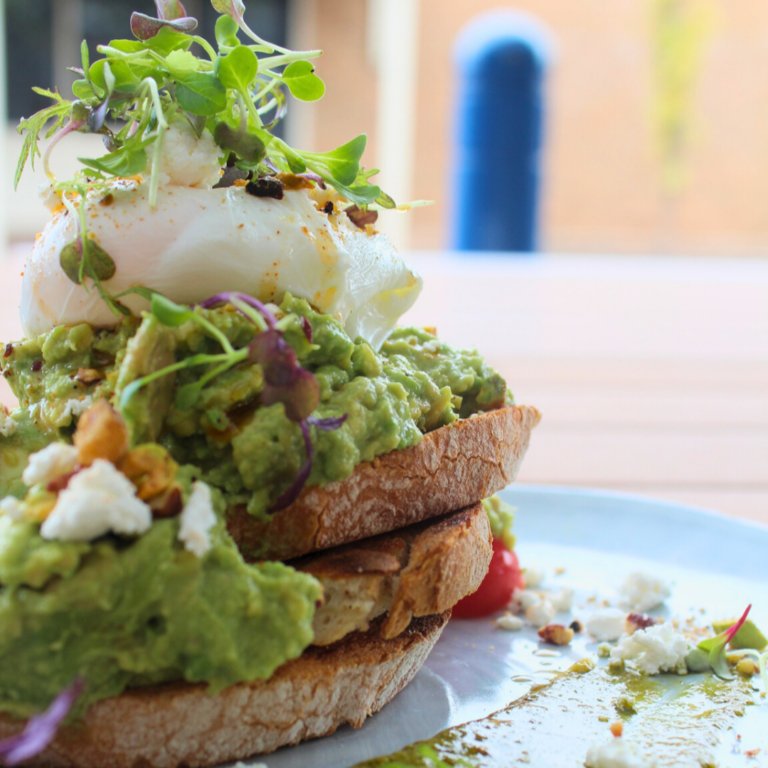 Smashed avocado on sourdough with poached egg
