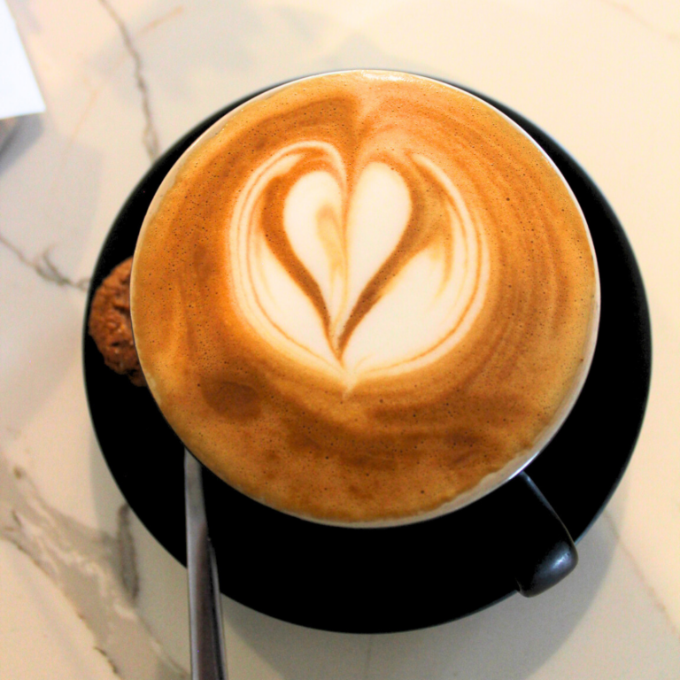 Flat white with heart latte art, house blend roasted locally